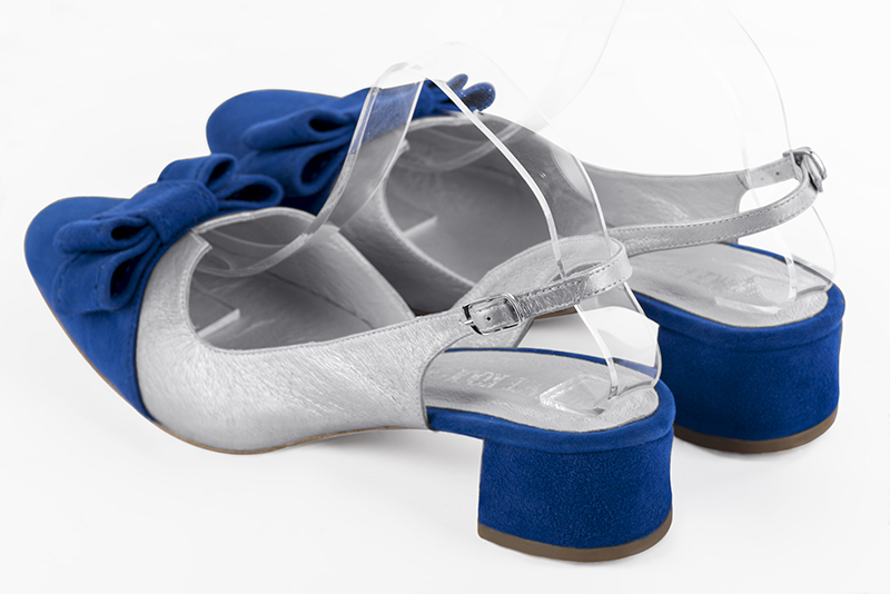 Electric blue and light silver women's open back shoes, with a knot. Round toe. Low flare heels. Rear view - Florence KOOIJMAN